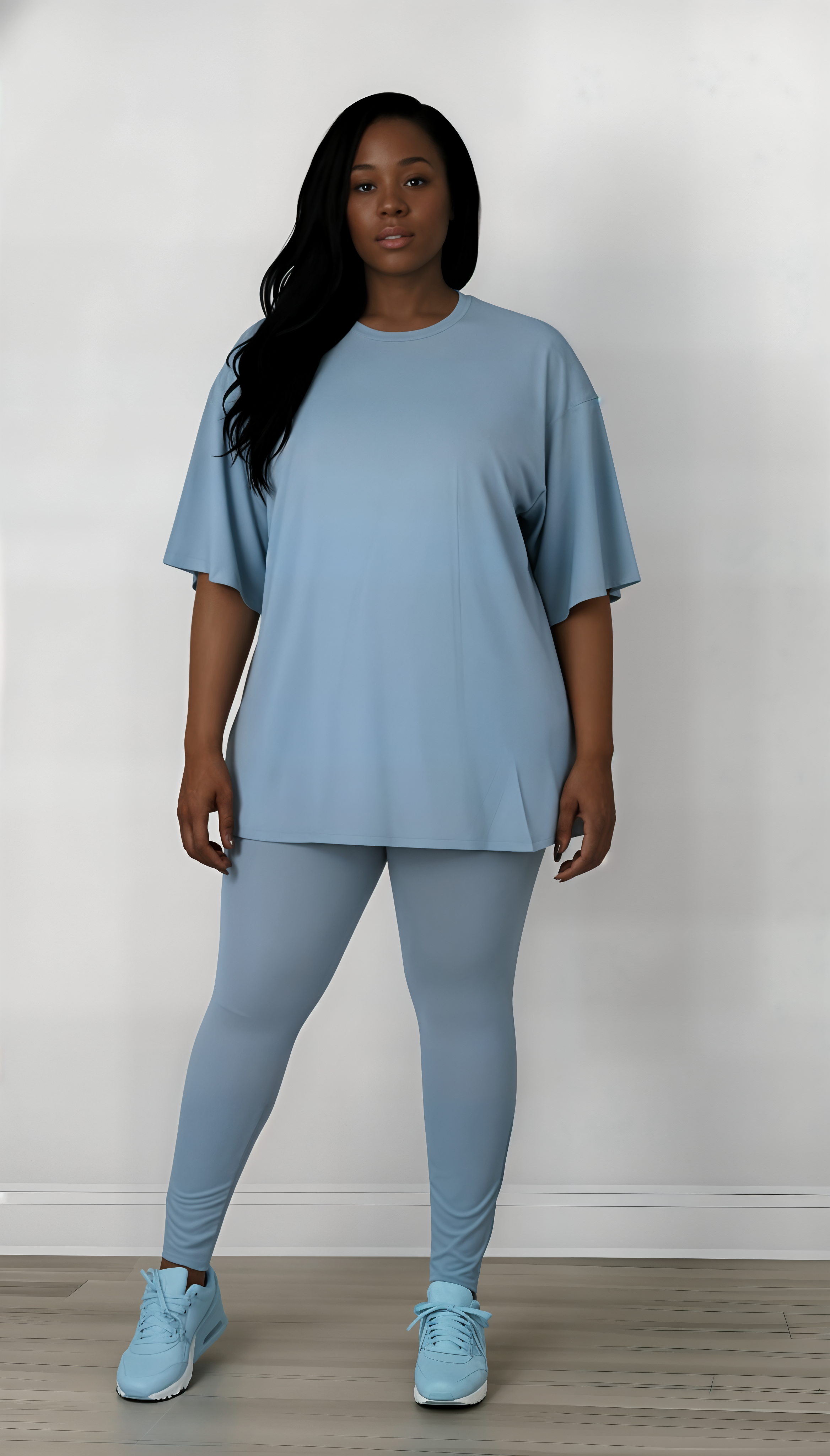 Woman wearing a light blue outfit with matching shoes against a white background