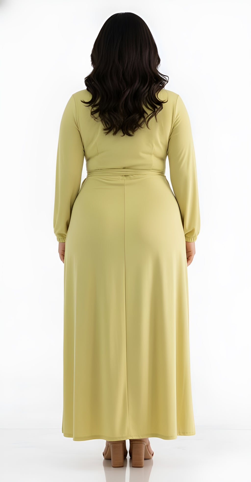 Woman wearing a long light green chartreuse dress on a white background